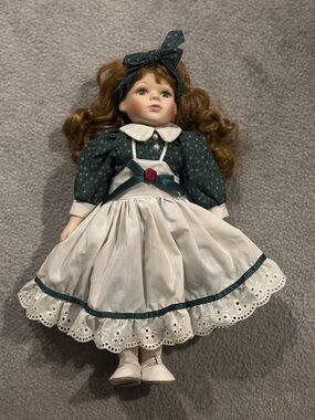 Seymour Mann Connoisseur Collection Porcelain Doll in Green Dress with Headband